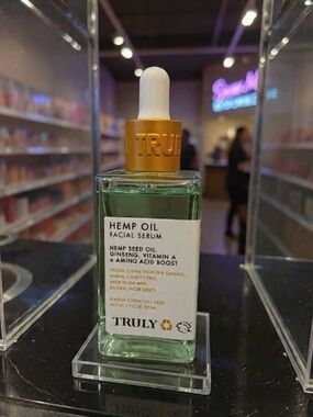 TRULY Hemp Oil Facial Serum in green with gold dropper